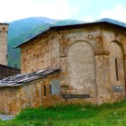 Biserica este dedicată Adormirii Maicii Domnului, însă svanii o numesc pe Maria „Lama”, legată de un vechi cult precreștin al zeiței Lamara, simbol al fertilității, maternității și abundenței.